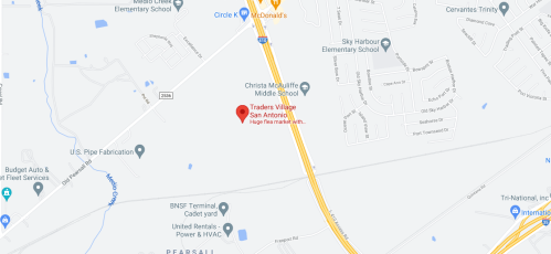 Map showing Traders Village in San Antonio, near schools and various businesses along a highway.