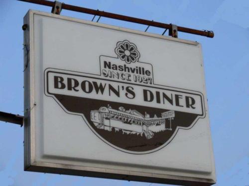 Sign for Brown's Diner in Nashville, established in 1921, featuring a vintage design and a flower logo.