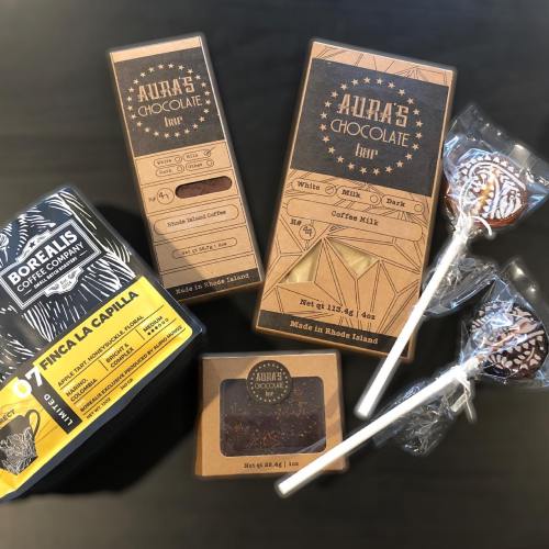 Assorted chocolates and lollipops from Aura's Chocolate, alongside coffee from Borealis Coffee Company.