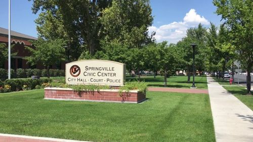 Sign for Springville Civic Center, surrounded by trees and grass, indicating City Hall, Court, and Police services.