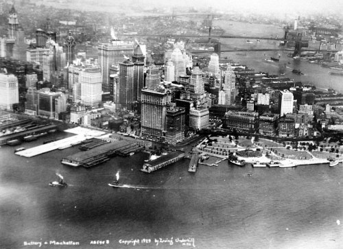 Aerial view of Battery Park and Manhattan, showcasing skyscrapers and boats in the harbor, circa 1929.
