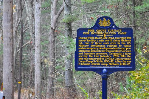 Historical marker about Pine Grove Furnace POW Interrogation Camp, detailing its WWII history and transformation post-war.