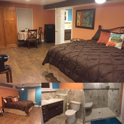 Cozy bedroom with a brown quilt, dining area, and modern bathroom featuring a shower and sink. Warm, inviting decor.