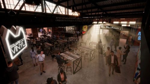 A lively indoor venue with tables, a bar, and a vinyl shop, featuring people socializing in a warm, inviting atmosphere.