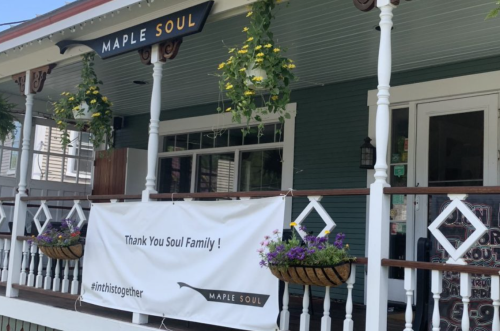A storefront with a sign reading "Maple Soul" and a banner saying "Thank You Soul Family! #inthistogether."