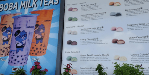 A colorful menu featuring boba milk teas and ice cream flavors, with illustrations and descriptions of each item.