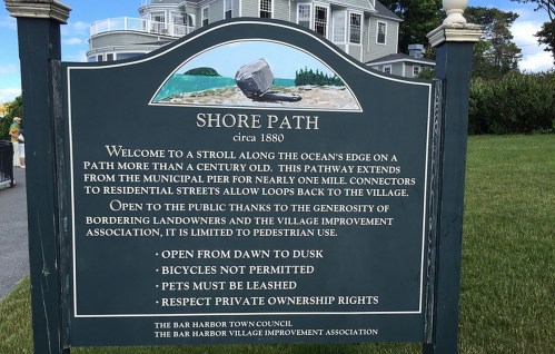Sign for Shore Path, established circa 1880, detailing rules for public access and usage near the ocean.