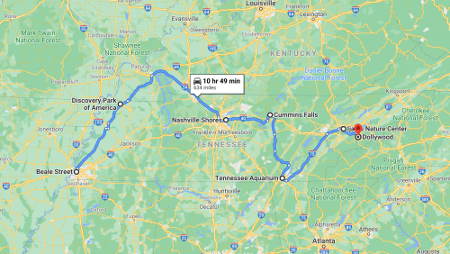 Map showing a route from Discovery Park of America to Dollywood, highlighting stops at Cummins Falls and Tennessee Aquarium.