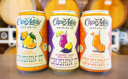Three colorful cans of Cape May Brewing Co.'s "Crushin' It" India Pale Ale: orange, blueberry lemon, and grapefruit flavors.