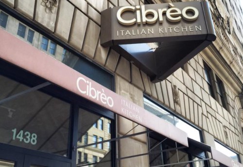 Sign for Cibreo Italian Kitchen, featuring the restaurant name and address, with a stylish awning above the entrance.