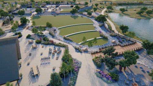 Aerial view of a landscaped park featuring ponds, pathways, seating areas, and greenery.