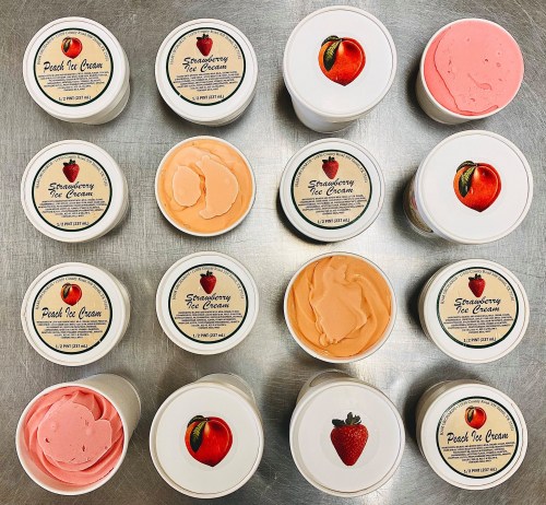 A grid of ice cream containers labeled "Strawberry" and "Peach," featuring pink and orange ice cream inside.