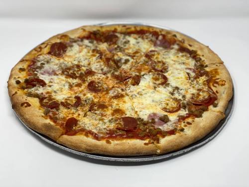 A large pizza with pepperoni, sausage, and melted cheese on a golden crust, sliced into eight pieces.