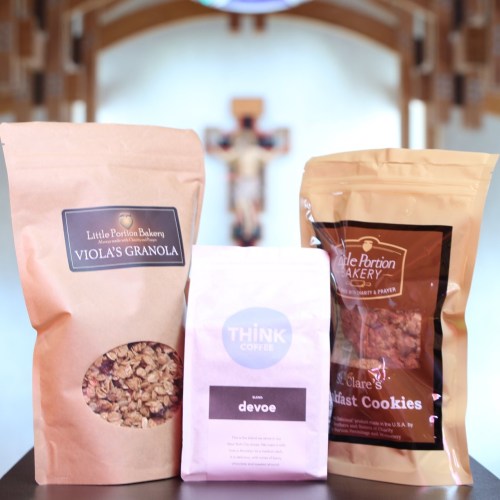 Three bags of baked goods: Viola's Granola, Devoe coffee, and St. Clare's Cookies, displayed against a blurred background.