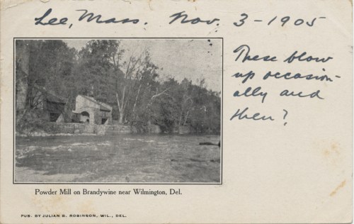Black and white postcard of a powder mill by a river, with handwritten note dated Nov. 3, 1905.