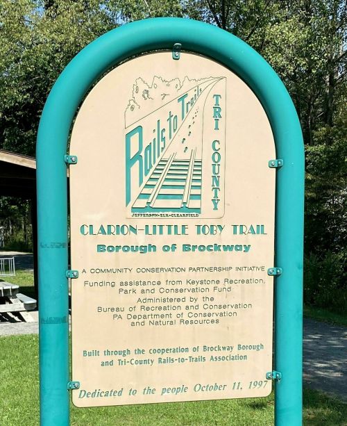 Sign for the Clarion-Little Toby Trail in Brockway, highlighting conservation efforts and community partnership.