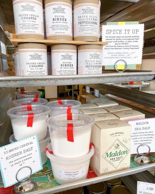 Shelves displaying various spice jars and salt containers, including Maldon sea salt and Diamond Crystal kosher salt.