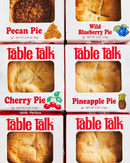 Six pie boxes from Table Talk featuring Pecan, Wild Blueberry, Cherry, and Pineapple flavors.