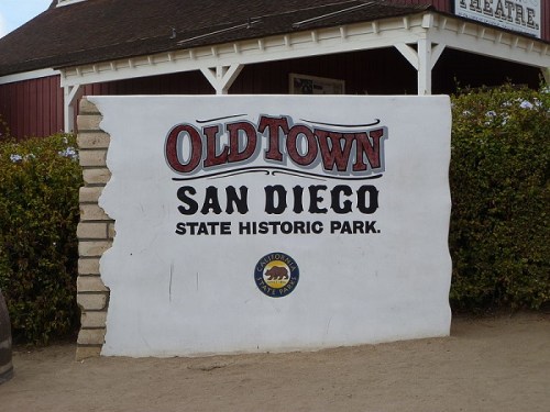 Sign for Old Town San Diego State Historic Park, featuring bold lettering and a California state park emblem.