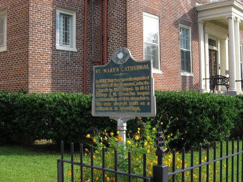 Historical marker for St. Mary's Cathedral, detailing its significance and construction in Mississippi.