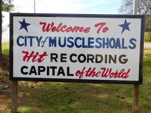 Sign welcoming visitors to Muscle Shoals, labeled as the "Hit Recording Capital of the World."