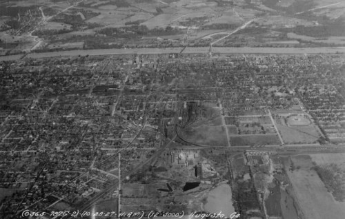 Aerial view of Augusta, Georgia, showcasing urban and rural landscapes, with roads and buildings visible.