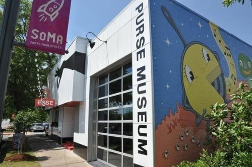 Exterior of the Purse Museum featuring colorful murals and a sign for South Main Street (SOMA).