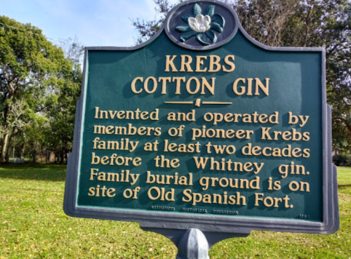 Historical marker for Krebs Cotton Gin, noting its invention by the Krebs family and the nearby family burial ground.
