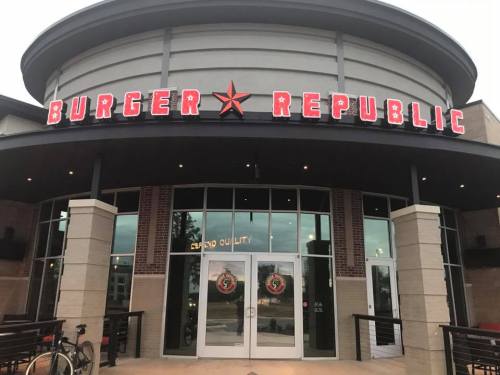 Exterior of Burger Republic restaurant with a modern design and large red signage.
