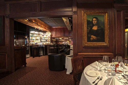 Elegant restaurant interior featuring a bar, dining area, and a framed painting resembling the Mona Lisa.