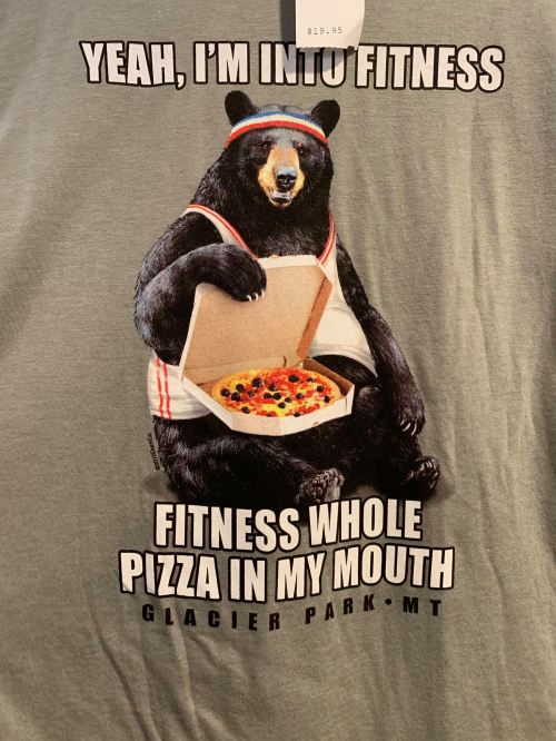 A bear wearing a headband holds a pizza box, with the text: "Yeah, I'm into fitness. Fitness whole pizza in my mouth."