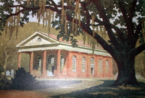 A historic brick building with columns, surrounded by trees and moss, set in a serene landscape.