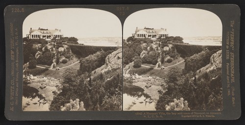 A historic stereograph showing a large house on a cliff overlooking a bay and the town of Newport in the distance.
