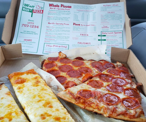 A pizza box with pepperoni pizza and cheese breadsticks, alongside a menu for Matt B's Main St. Pizza.