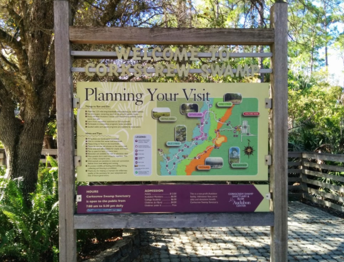 Sign at Corkscrew Swamp welcoming visitors and providing a map and information for planning their visit.
