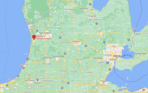 Map showing Michigan with a red marker indicating the location of Urban Air Adventure Park near Grand Rapids.