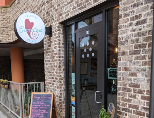 Exterior of a gelato shop with a sign reading "American Creamless Gelato" and a chalkboard menu outside.