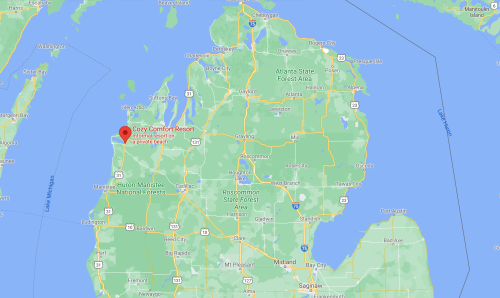 Map showing Michigan with a marker for Cozy Comfort Resort near a private beach.