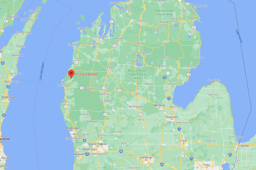Map showing the location of Orchard Market in Michigan, near the northwest coast, with surrounding green areas.