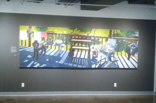 A colorful mural depicting a sunny porch scene with a dog, plants, and furniture, casting shadows on the floor.