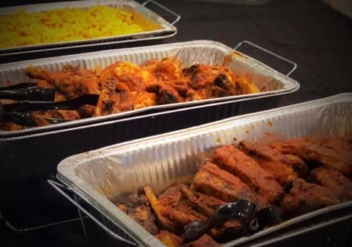 Three trays of food: one with yellow rice, and two with seasoned meats, all served with tongs.