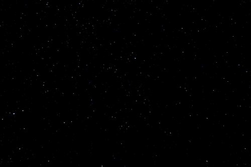 A vast night sky filled with countless stars against a black background.