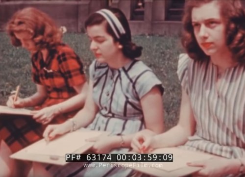 Three young women sit outdoors, sketching on clipboards, dressed in vintage clothing.