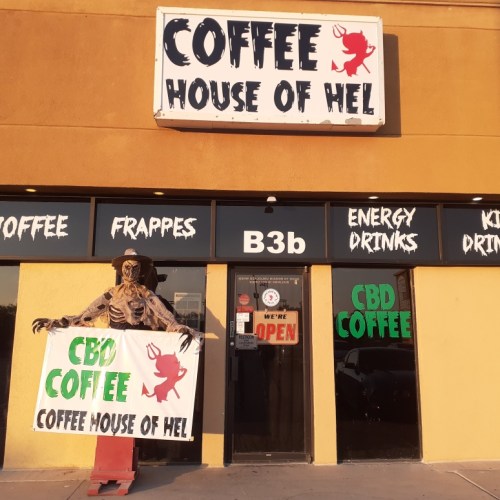 A quirky coffee shop named "Coffee House of Hel" with a skeleton holding a sign for CBD coffee.
