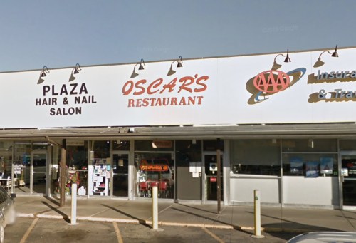 Signage for Plaza Hair & Nail Salon and Oscar's Restaurant, with AAA and insurance services visible in the storefront.
