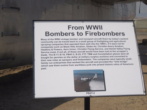 Sign explaining the transition from WWII bombers to firebombers, featuring a PBY-2 aircraft and historical context.
