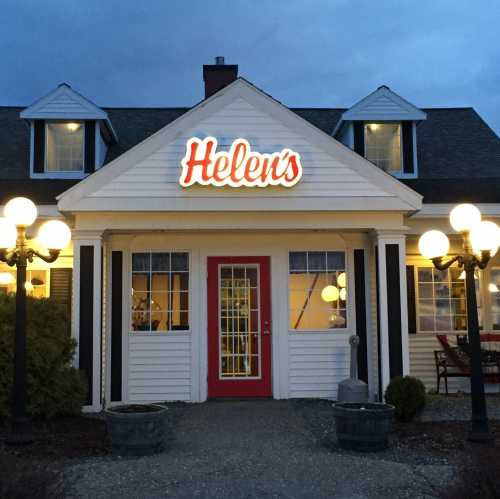 A cozy restaurant named "Helen's" with a welcoming entrance and decorative lamps, set against a twilight sky.