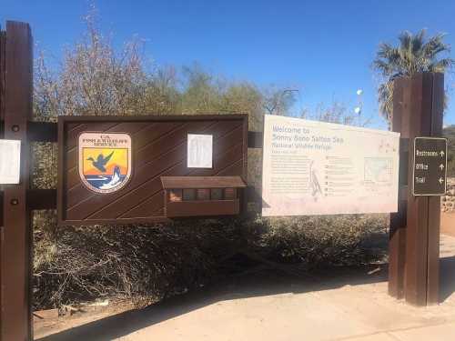 Sign at the entrance of the Sonny Bono Salton Sea National Wildlife Refuge, with information and a map.