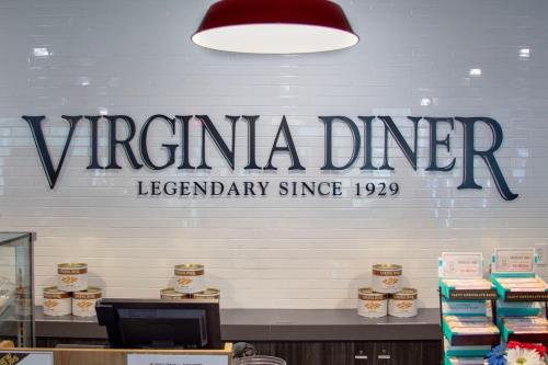 Sign for Virginia Diner, stating "Legendary Since 1929," with a display counter in the foreground.