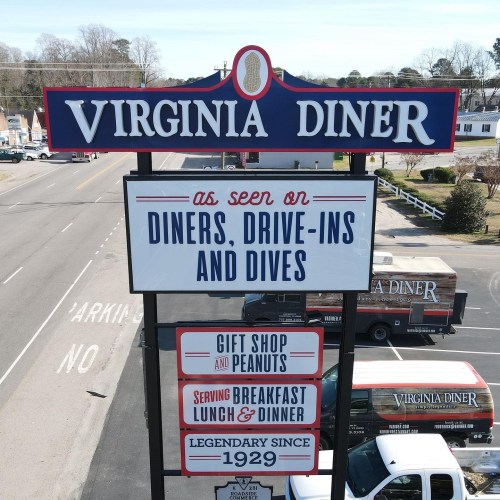 Sign for Virginia Diner, featuring "as seen on Diners, Drive-Ins and Dives," with details about the gift shop and meals.